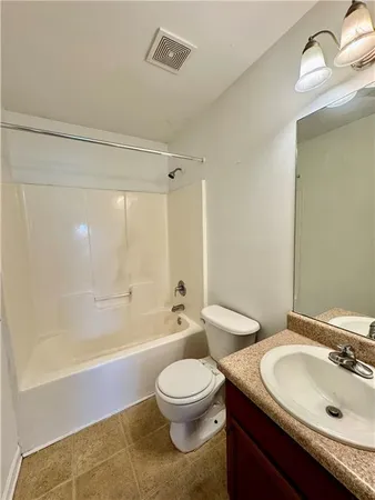 a bathroom with a sink a toilet and a bathtub