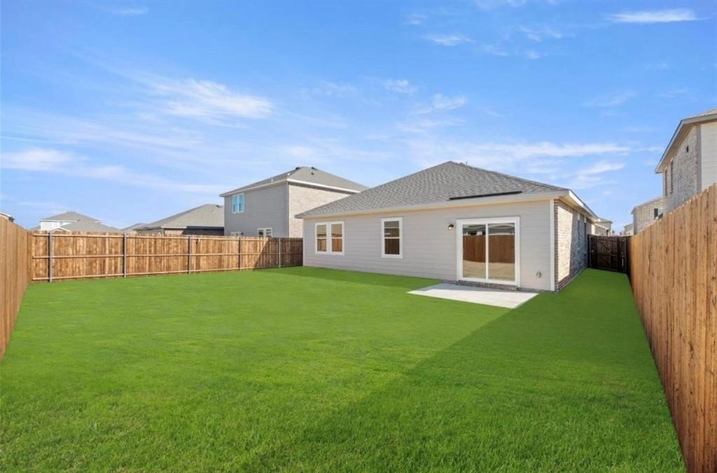10308 Holy Cross Lane Crowley, TX 76036 - Photo 2 of 27 a view of a yard in front of a house with a large tree