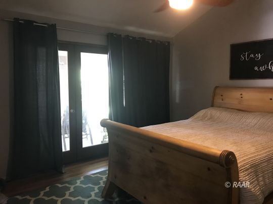 1009 Meadowview Lane Ridgecrest, CA 93555 - Photo 21 of 32 a bedroom with a bed and a window