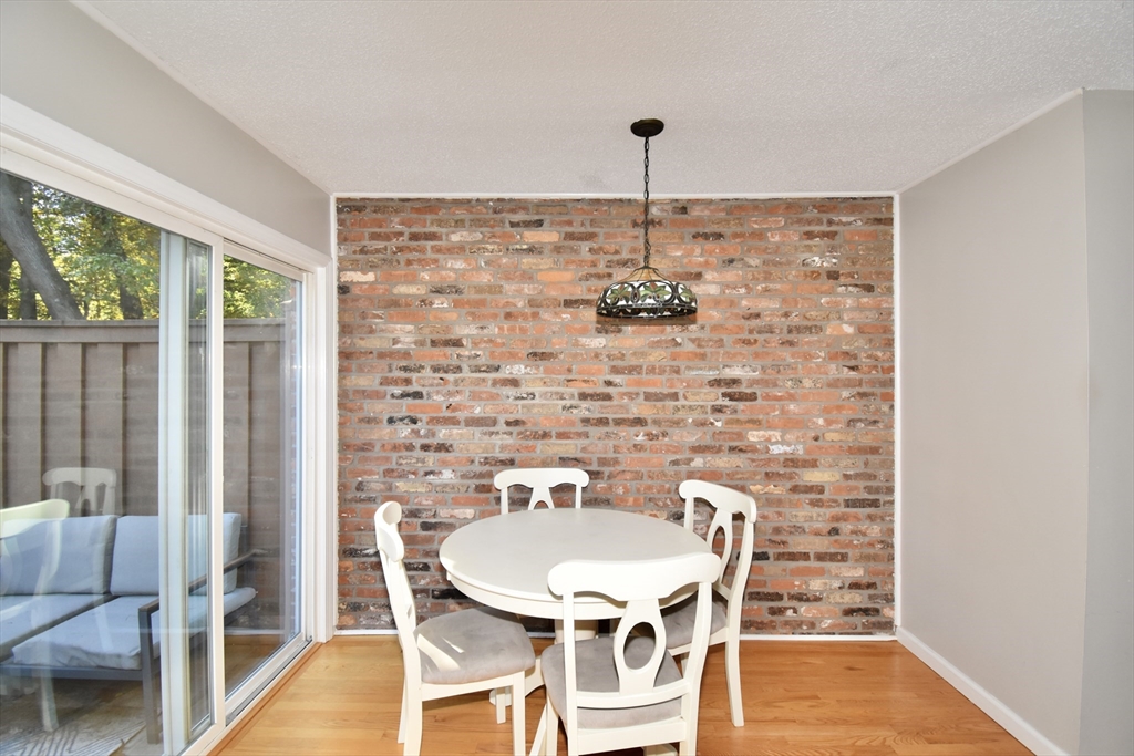 15 Yorktown Drive, Unit 15 Springfield, MA 01108 - Photo 11 of 22 a view of a dining room with furniture window and outside view