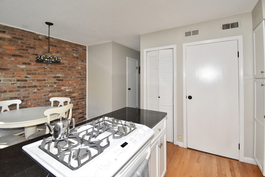 15 Yorktown Drive, Unit 15 Springfield, MA 01108 - Photo 12 of 22 a very nice looking dining room with a wooden floor