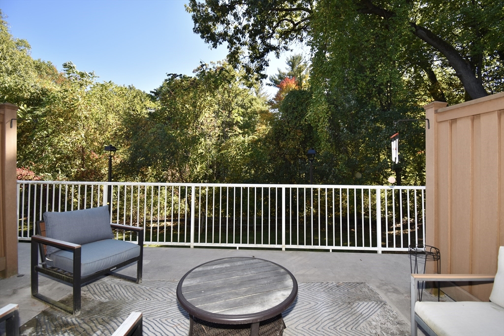 15 Yorktown Drive, Unit 15 Springfield, MA 01108 - Photo 15 of 22 a balcony with wooden floor and fence