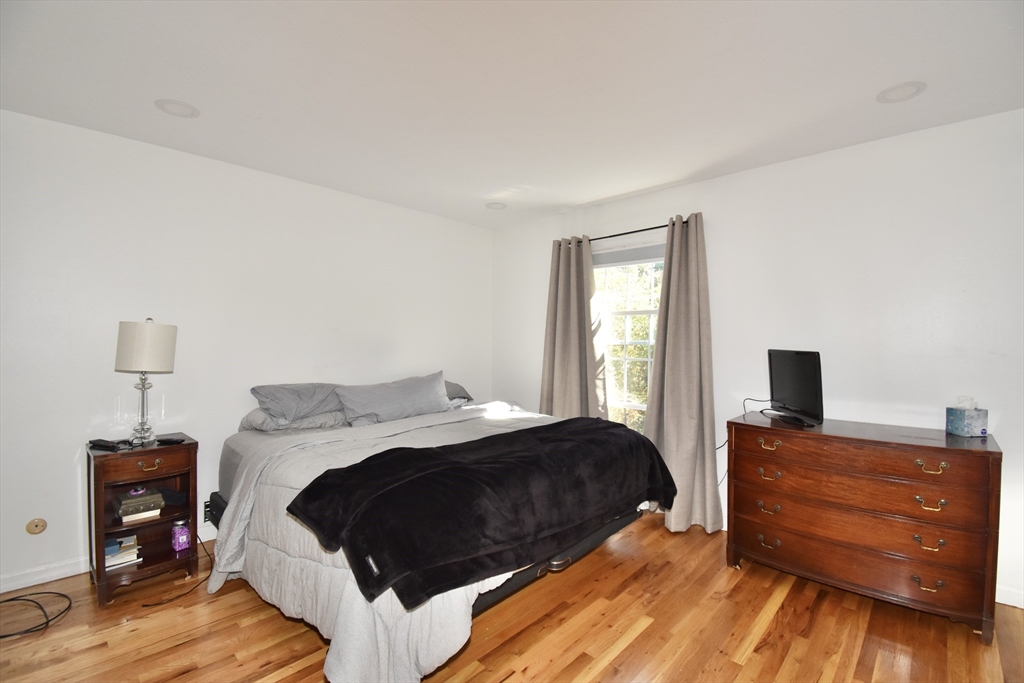 15 Yorktown Drive, Unit 15 Springfield, MA 01108 - Photo 19 of 22 a bedroom with a bed and a tv