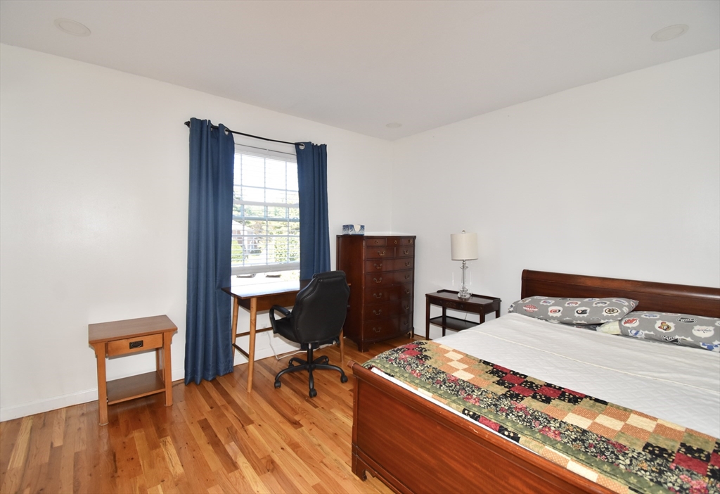 15 Yorktown Drive, Unit 15 Springfield, MA 01108 - Photo 20 of 22 a bedroom with a bed and wooden floor