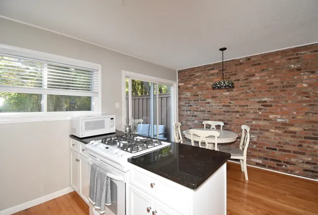 a kitchen with a stove a sink and a refrigerator