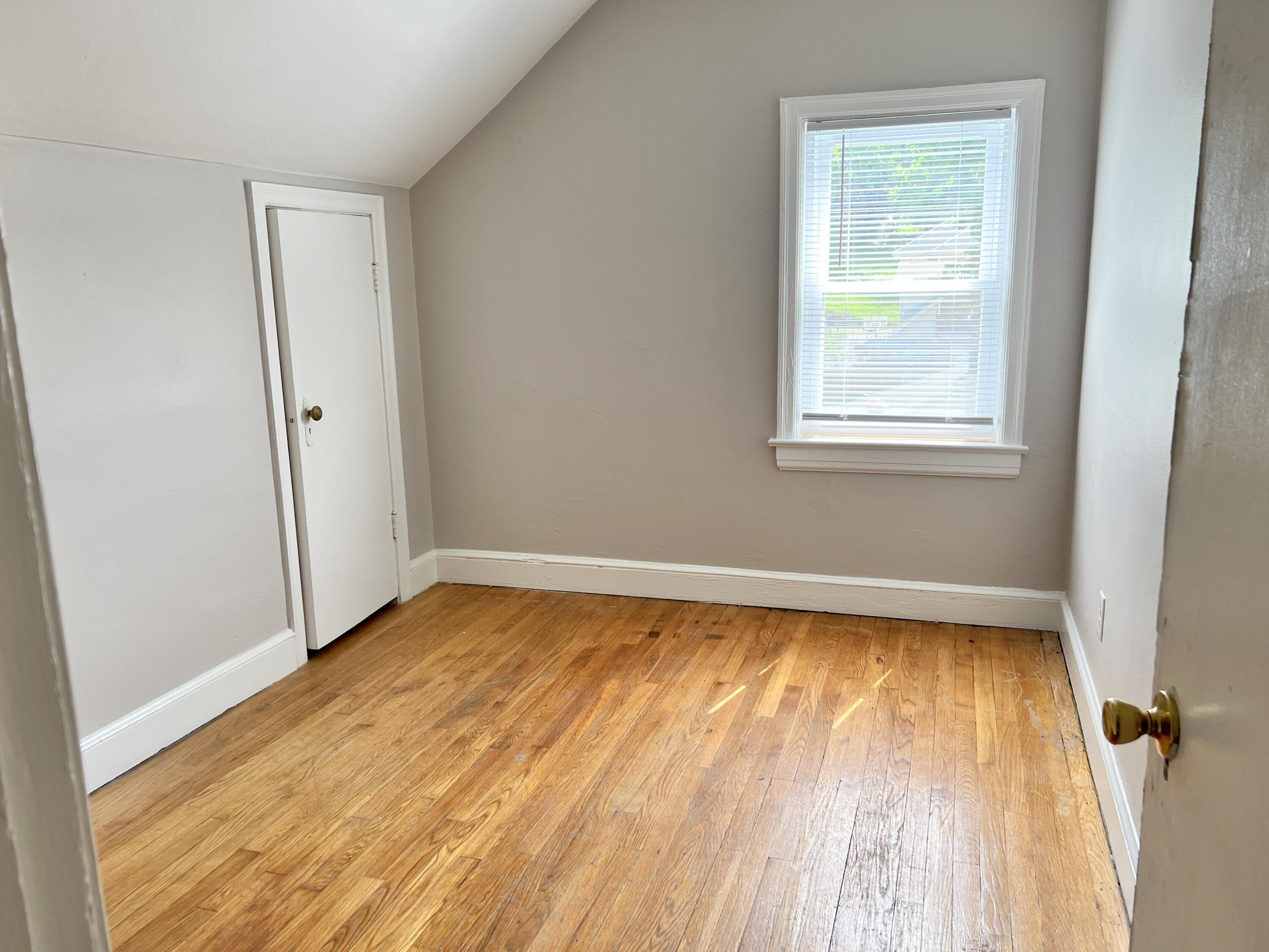 2703 Broad Street Northwest, Unit 6 Roanoke, VA 24012 - Photo 12 of 19 a view of a room with wooden floor and window