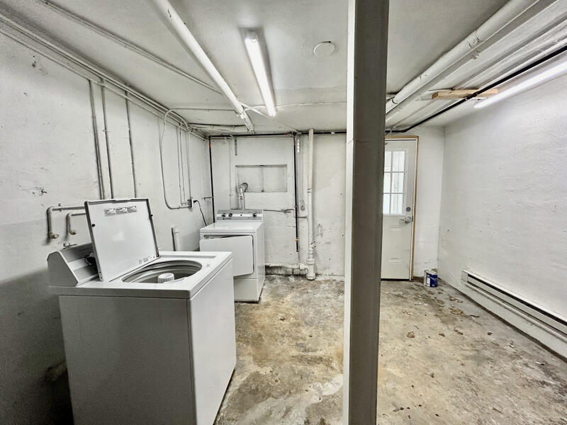 2703 Broad Street Northwest, Unit 6 Roanoke, VA 24012 - Photo 18 of 19 a kitchen that has a sink a refrigerator and cabinets