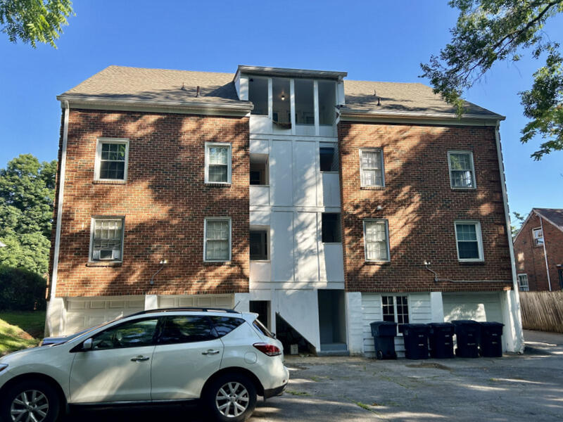 2703 Broad Street Northwest, Unit 6 Roanoke, VA 24012 - Photo 5 of 19 a front view of a house with a parking space