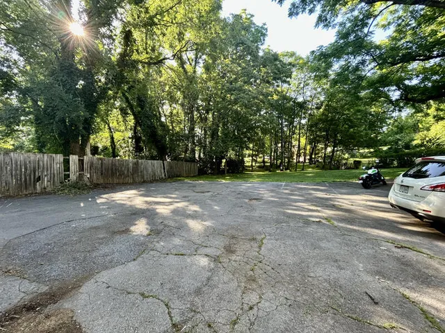 a view of street with parked cars