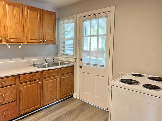 a kitchen with sink and cabinets