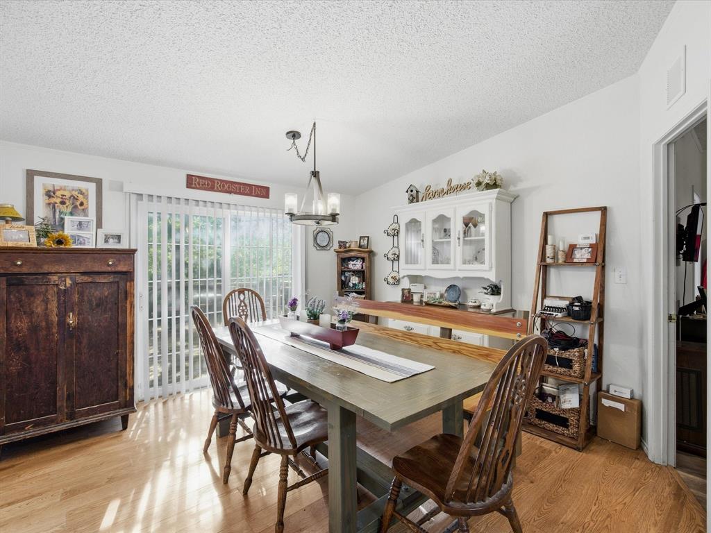 3275 Finis Road Graham, TX 76450 - Photo 13 of 36 a dining room with furniture and wooden floor