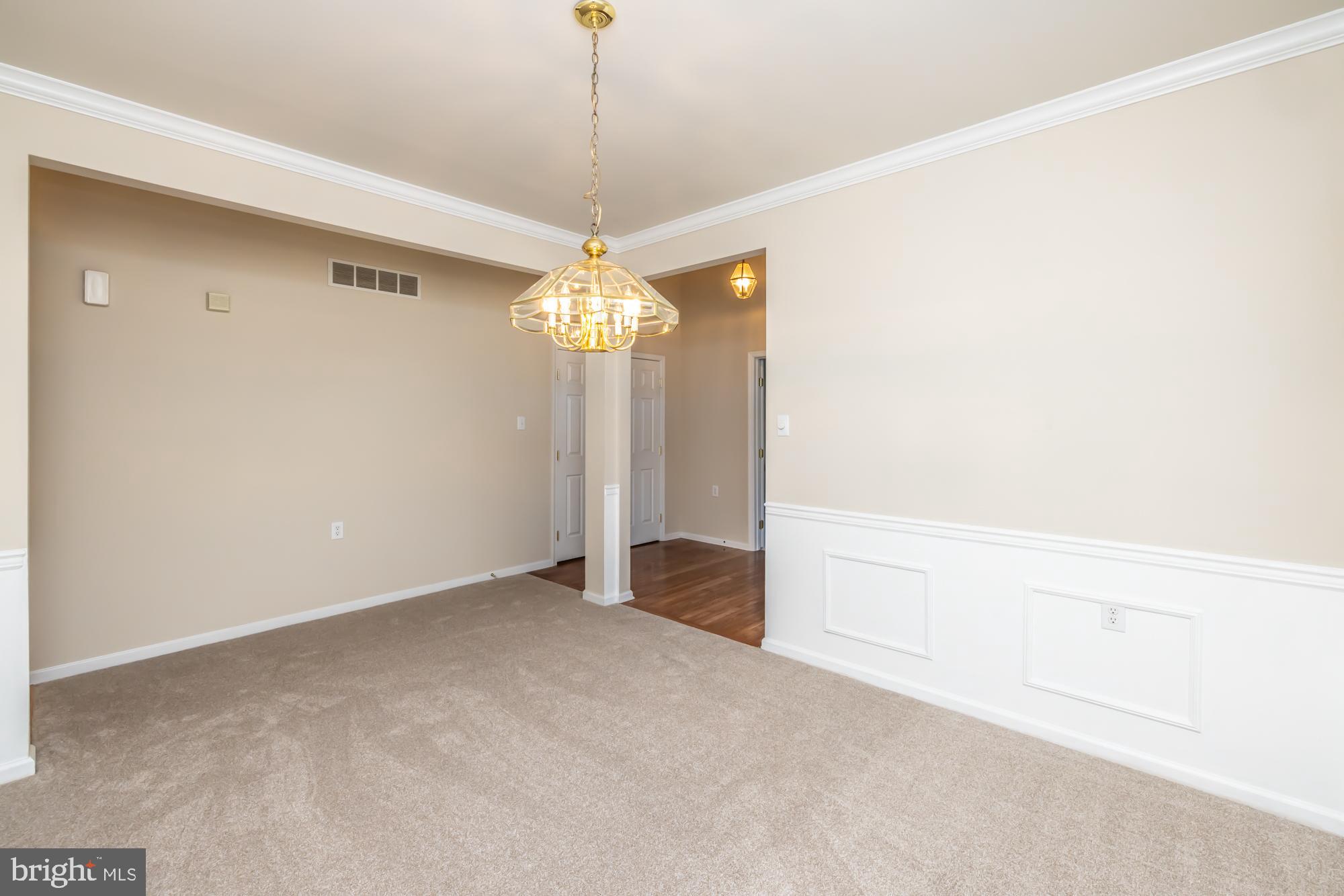 209 Kendig Road Coatesville, PA 19320 - Photo 14 of 47 a view of an empty room with a chandelier