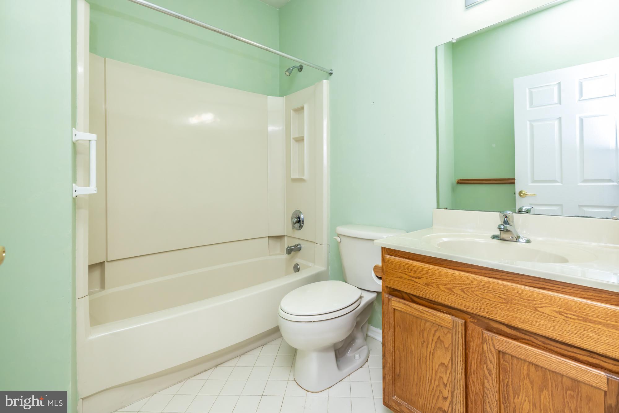 209 Kendig Road Coatesville, PA 19320 - Photo 15 of 47 a bathroom with a sink a toilet and shower