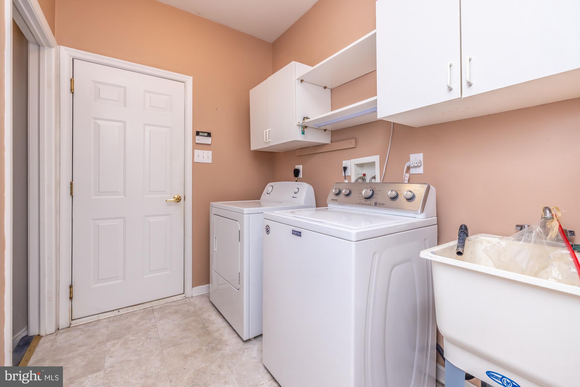 209 Kendig Road Coatesville, PA 19320 - Photo 16 of 47 a utility room with cabinets washer and dryer