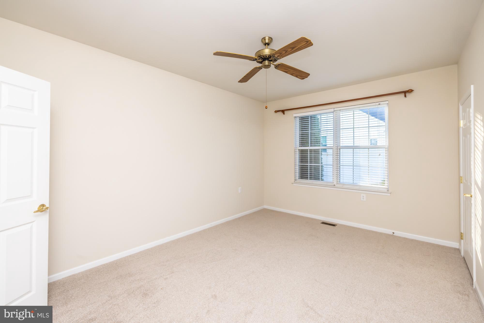 209 Kendig Road Coatesville, PA 19320 - Photo 18 of 47 a view of a room with a window and a ceiling fan