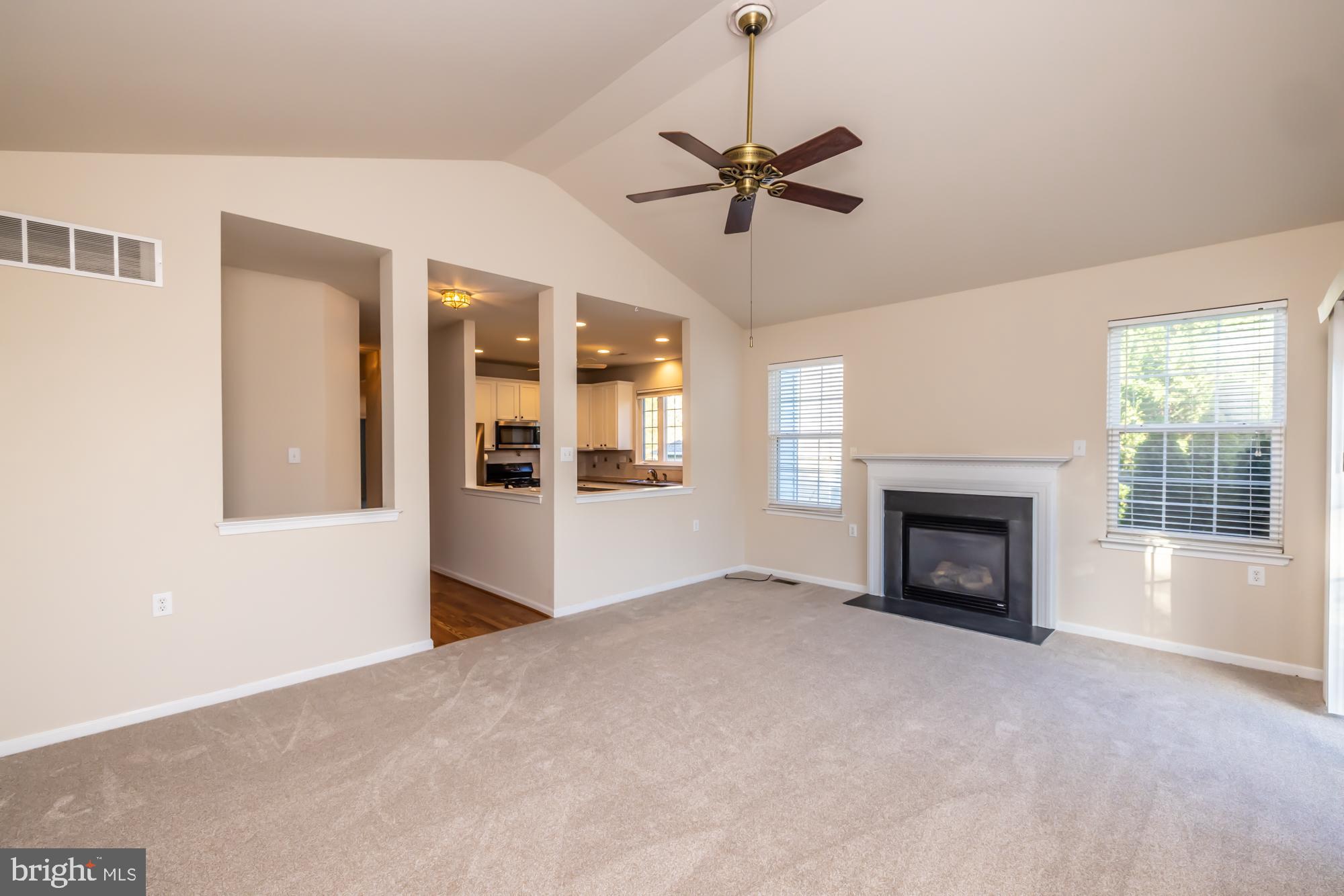 209 Kendig Road Coatesville, PA 19320 - Photo 22 of 47 a view of an empty room with a fireplace and a window