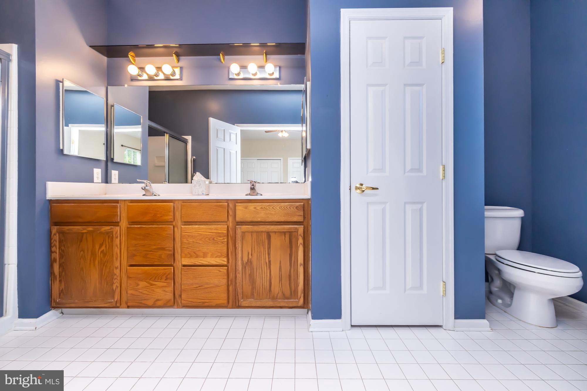 209 Kendig Road Coatesville, PA 19320 - Photo 28 of 47 a view of bathroom with a toilet and a mirror