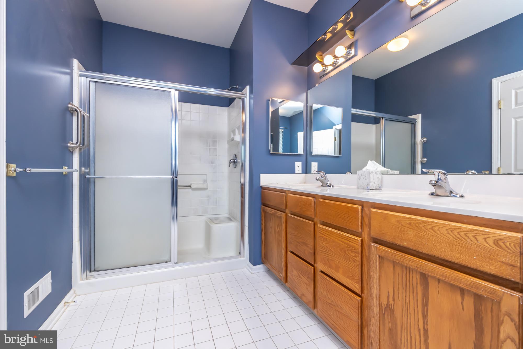 209 Kendig Road Coatesville, PA 19320 - Photo 29 of 47 a bathroom with a double vanity sink and a mirror