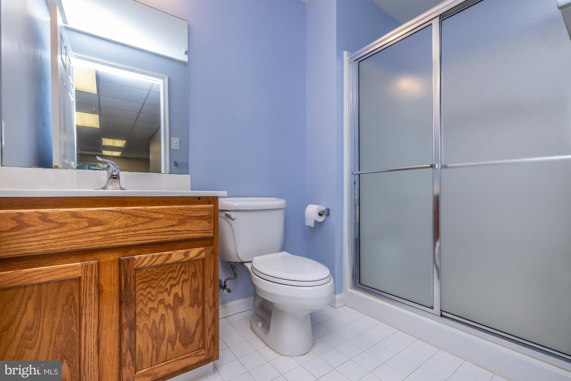 209 Kendig Road Coatesville, PA 19320 - Photo 33 of 47 a bathroom with a toilet a sink and mirror