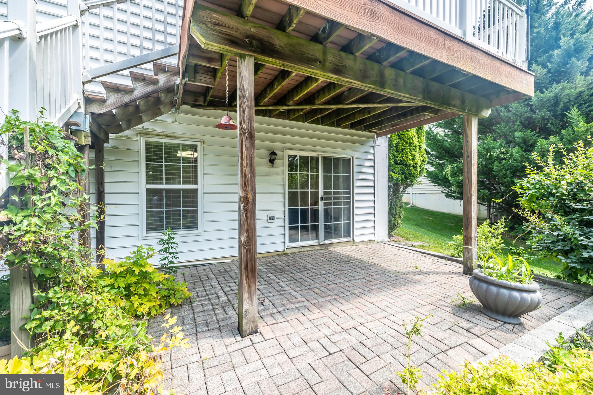 209 Kendig Road Coatesville, PA 19320 - Photo 45 of 47 a view of a backyard with table and chairs potted plants