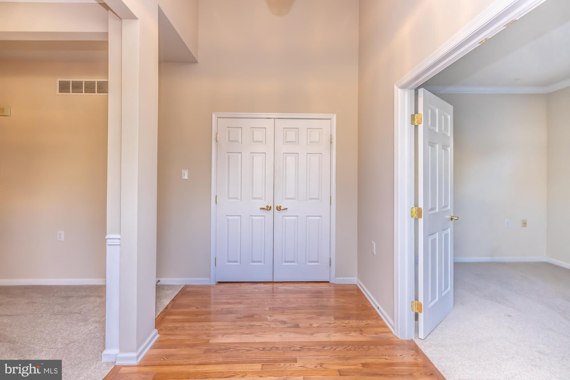 209 Kendig Road Coatesville, PA 19320 - Photo 8 of 47 a view of a hallway with wooden floor and closet area