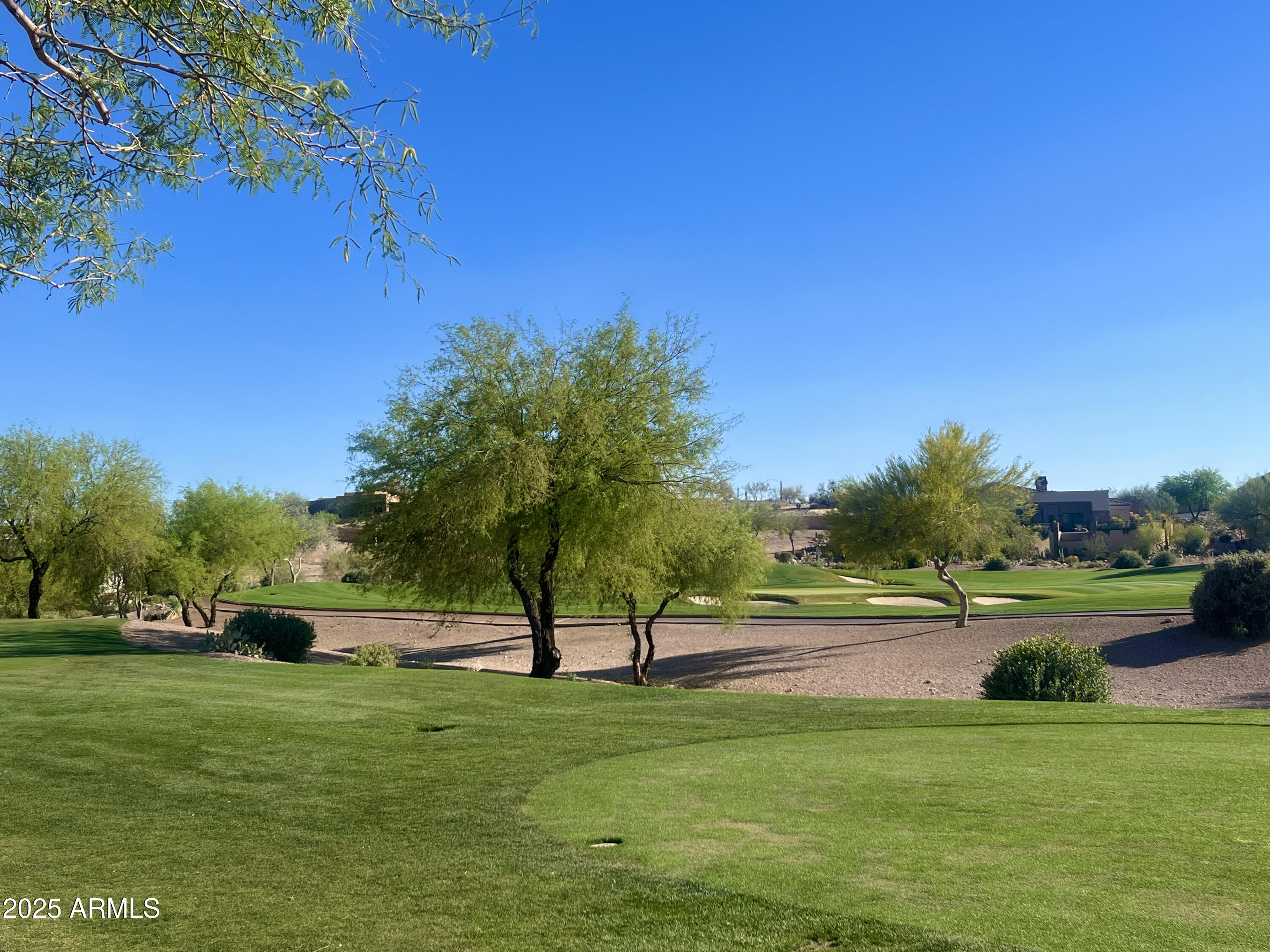 9233 East Superstition Mountain Drive, Unit 57 Gold Canyon, AZ 85118 - Photo 1 of 16 a view of a park with large trees