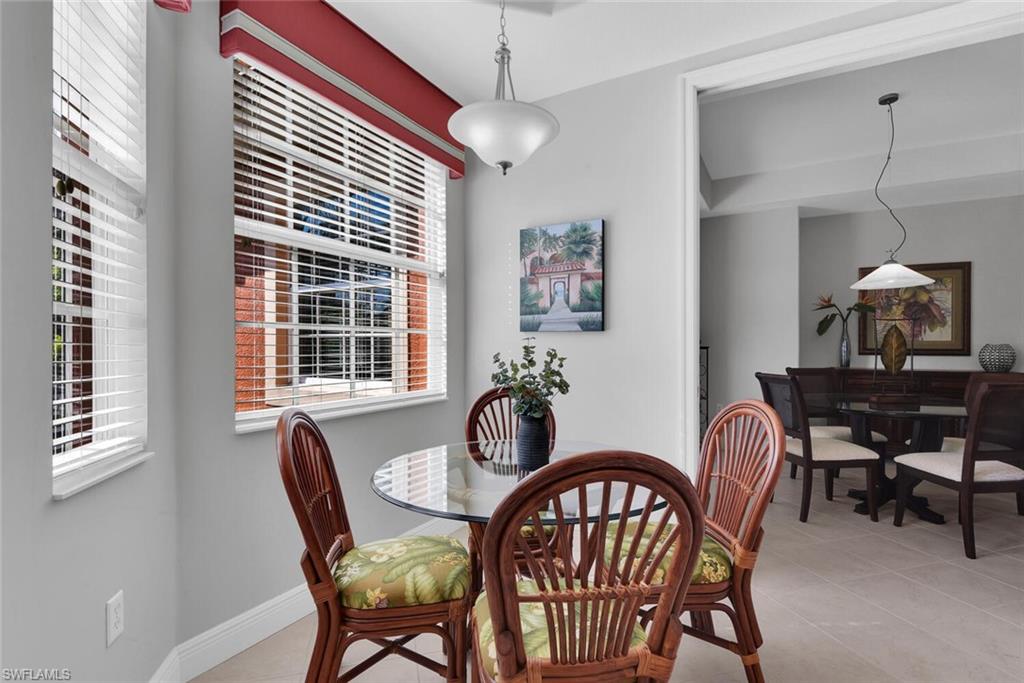 6413 Legacy Circle, Unit 1602 Naples, FL 34113 - Photo 14 of 34 a dining room with furniture and window