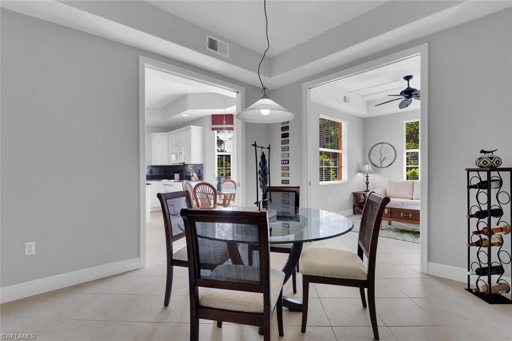 6413 Legacy Circle, Unit 1602 Naples, FL 34113 - Photo 18 of 34 a dining room with furniture and window