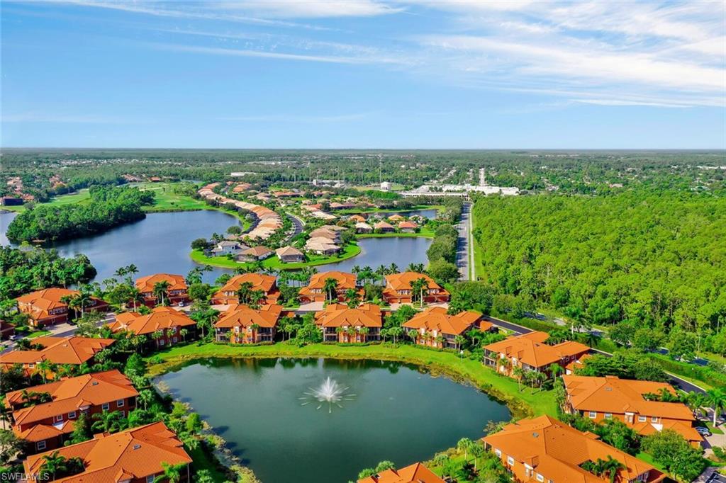 6413 Legacy Circle, Unit 1602 Naples, FL 34113 - Photo 34 of 34 an aerial view of a houses with a lake view