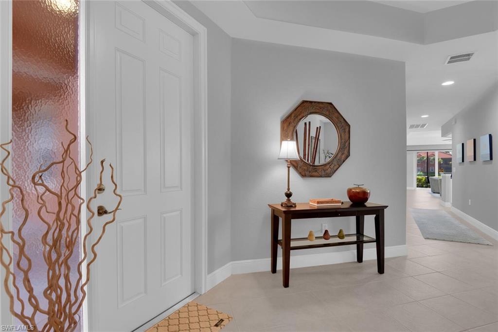 6413 Legacy Circle, Unit 1602 Naples, FL 34113 - Photo 6 of 34 a view of a room that has a bench and a bench in it