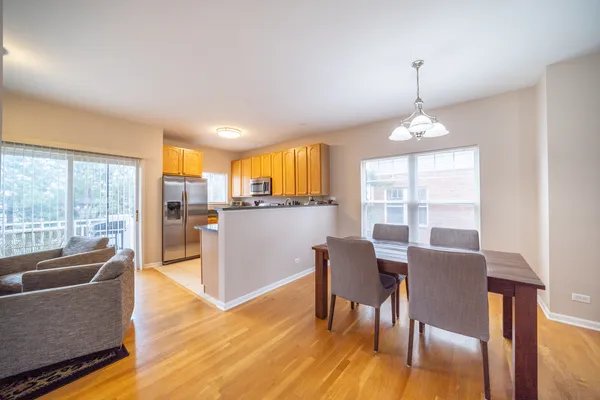 a view of a dining room with furniture window and wooden floor