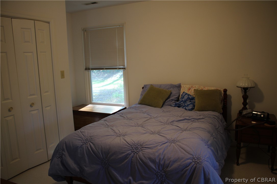 331 Thurston Road Mathews, VA 23109 - Photo 28 of 50 a bedroom with a bed and a window