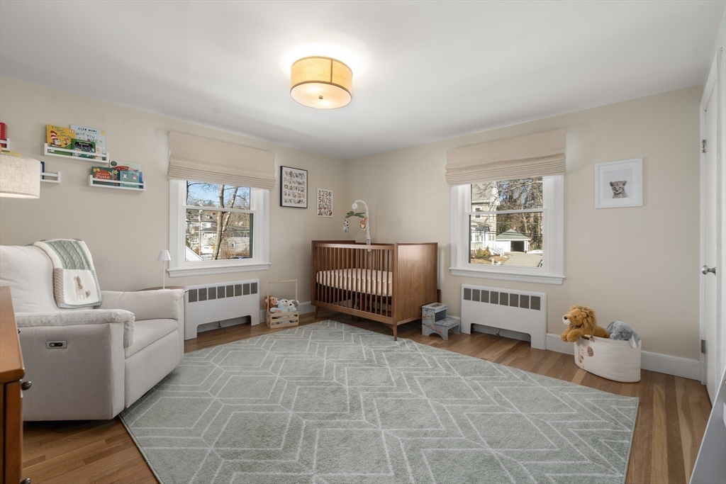 48 Spring Street Wakefield, MA 01880 - Photo 18 of 28 a bedroom with furniture and a window