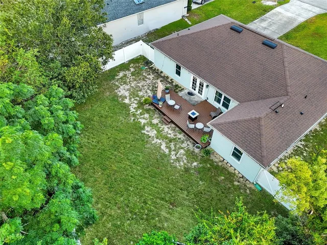 a front view of a house with a garden and yard