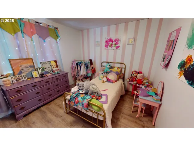 a bedroom with a bed and toys