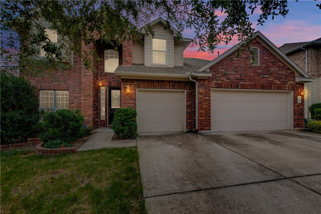 2607 Stagecoach Bend Leander, TX 78641 - Photo 1 of 1 a front view of a house with garden