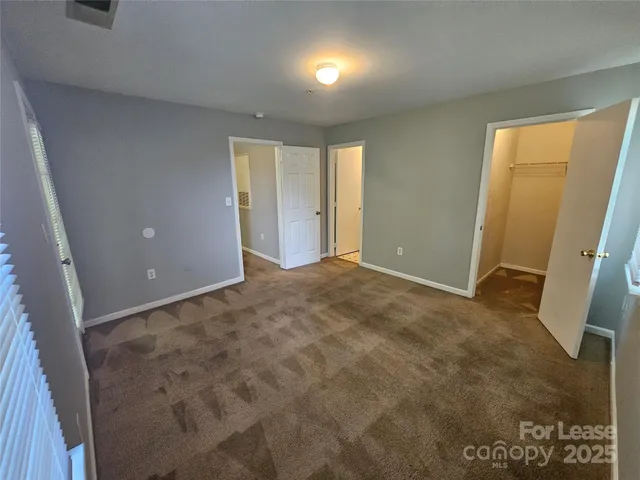 a view of livingroom with an empty space and a window