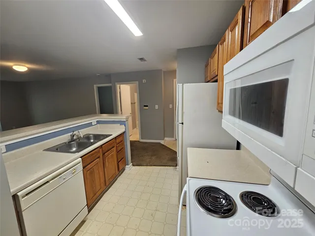a kitchen with a stove and a microwave
