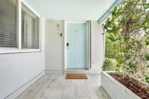 a view of outdoor space with sliding door and wooden floor