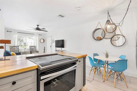 a kitchen with a table and chairs in it