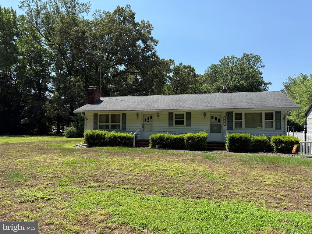 Charming home on spacious green lot.