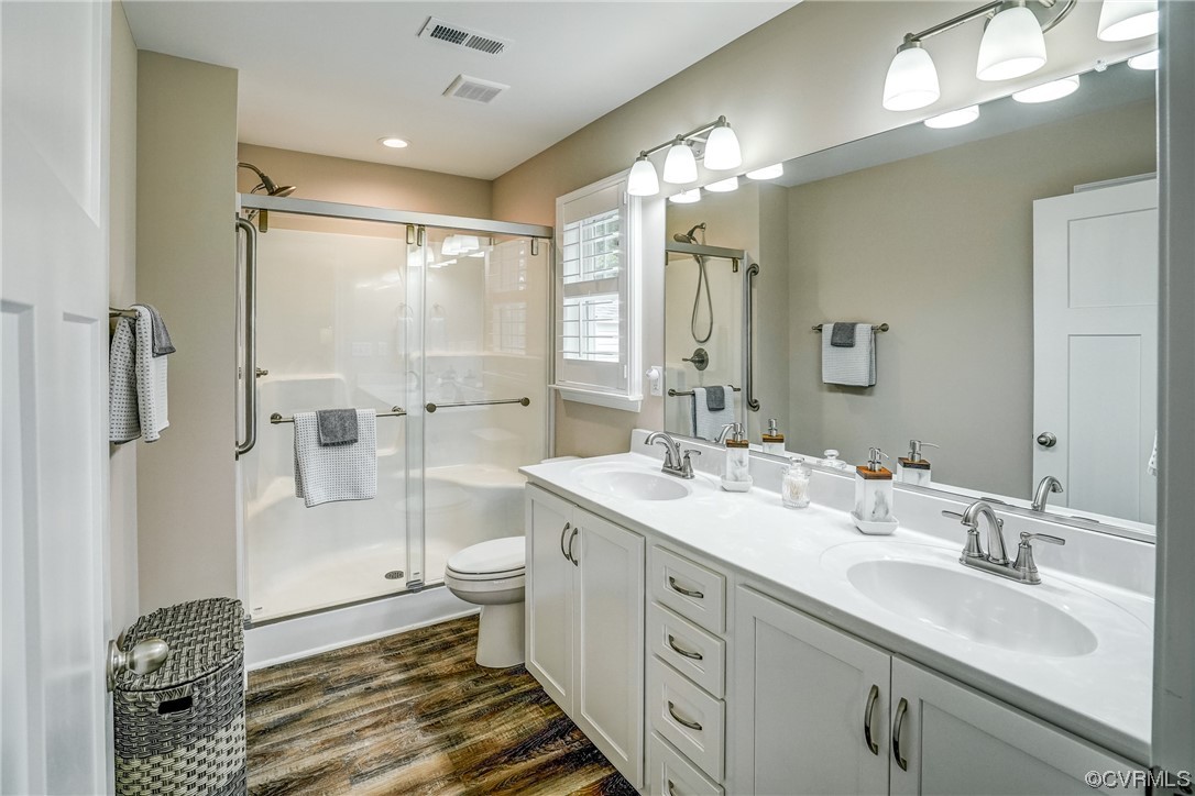 2672 Fredericks Hall Road Mineral, VA 23117 - Photo 23 of 44 a spacious bathroom with a double vanity sink toilet and shower