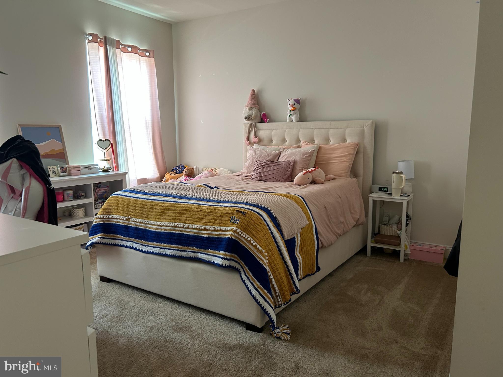 21 Midsummer Drive Newtown Square, PA 19073 - Photo 8 of 11 a bedroom with a bed and a window