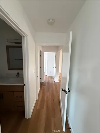 a view of a hallway with a wooden floors