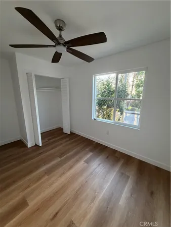 a view of an empty room and wooden floor