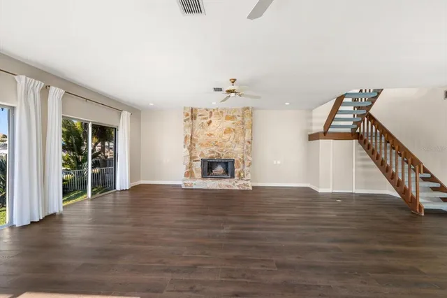 a kitchen with a refrigerator and a stove top oven