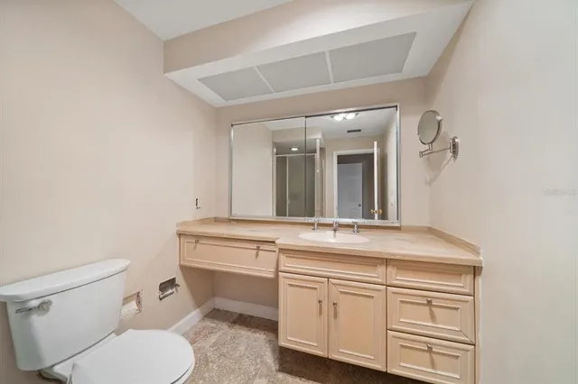a bathroom with a double vanity sink a mirror and a bathtub