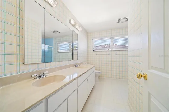 a house with swimming pool in front of it