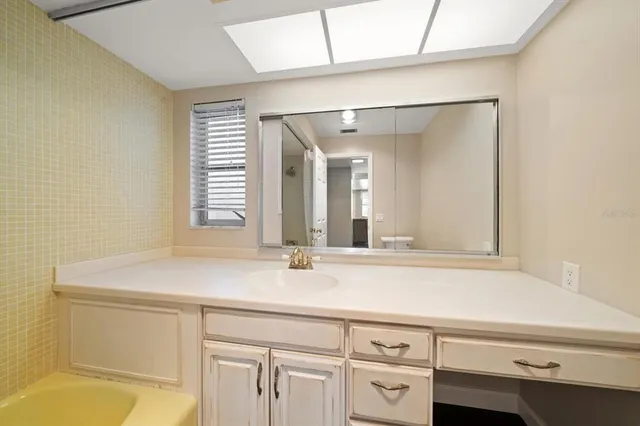 a view of a lake in middle of forest