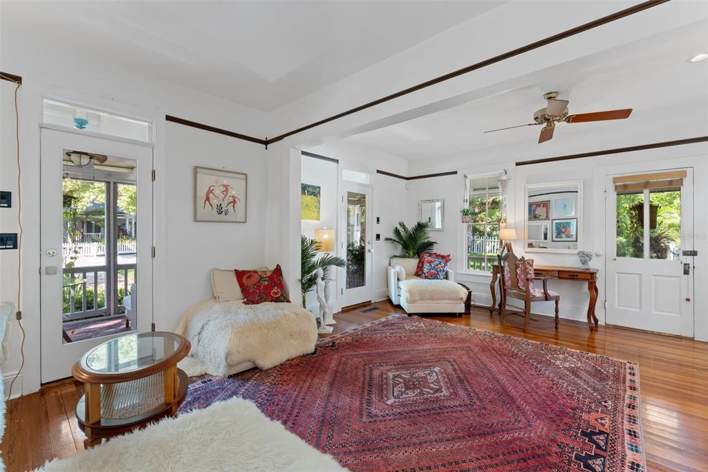 429 Scotland Street Dunedin, FL 34698 - Photo 12 of 78 a living room with furniture and a potted plant